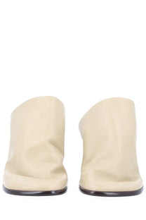 Lemaire women’s mule glove beige cream-colored leather mules with sleek minimalist design and dark brown soles