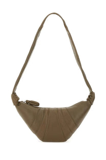 Green leather crossbody bag with curved fan shape and knotted shoulder strap from lemaire women’s small croissant bag brown