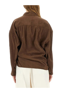 A brown softly textured lemaire women’s blouse with a relaxed fit and buttoned cuffs in straight collar style