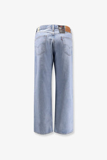 Levi’s men’s light-wash blue denim jeans with a wide-leg cut and classic back pockets showing the back side