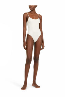 A sleek off-white lido women’s costume intero trentasei one-piece swimsuit with thin spaghetti straps and minimalist design