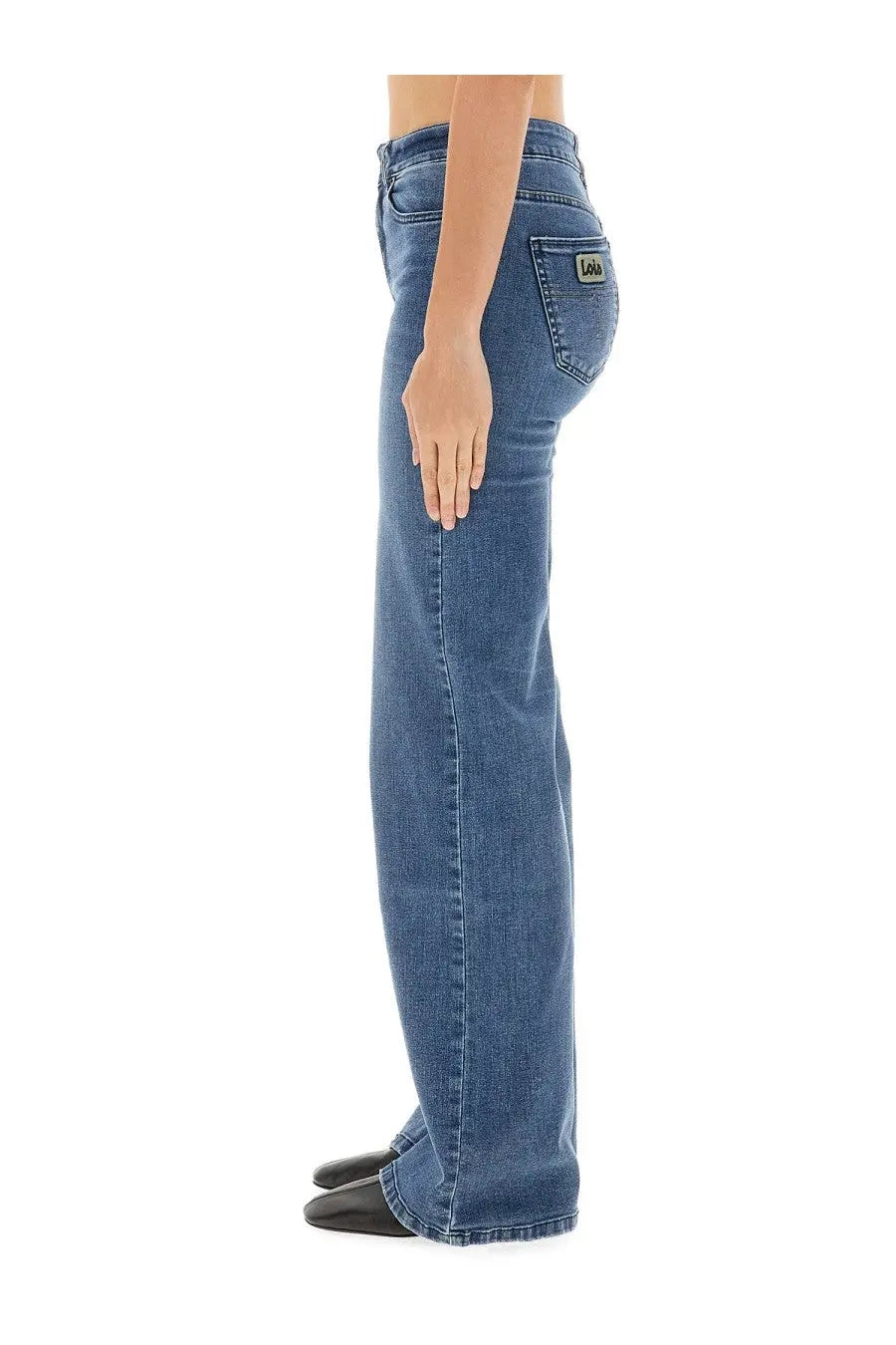 Blue denim classic fit jeans with subtle faded wash showing levi’s label on back pocket for women