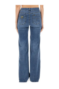 Lois jeans women’s palazzo pants blue showing back side with blue denim straight-leg cut and small lob brand patch