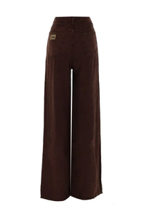 Brown wide-leg denim pants with classic back pockets and a small brand label on the waistband shown from the back