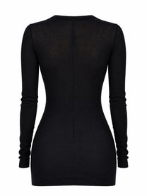 Black long sleeved fitted dress by rick owens with subtle sheer back panel and central zipper shown from the back