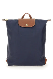 Navy blue longchamp le pliage original medium women’s backpack with brown leather accents and gold-tone hardware