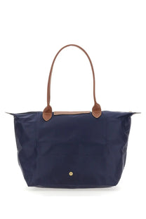 Navy blue longchamp le pliage large tote bag with brown leather handles and gold-tone logo button for women