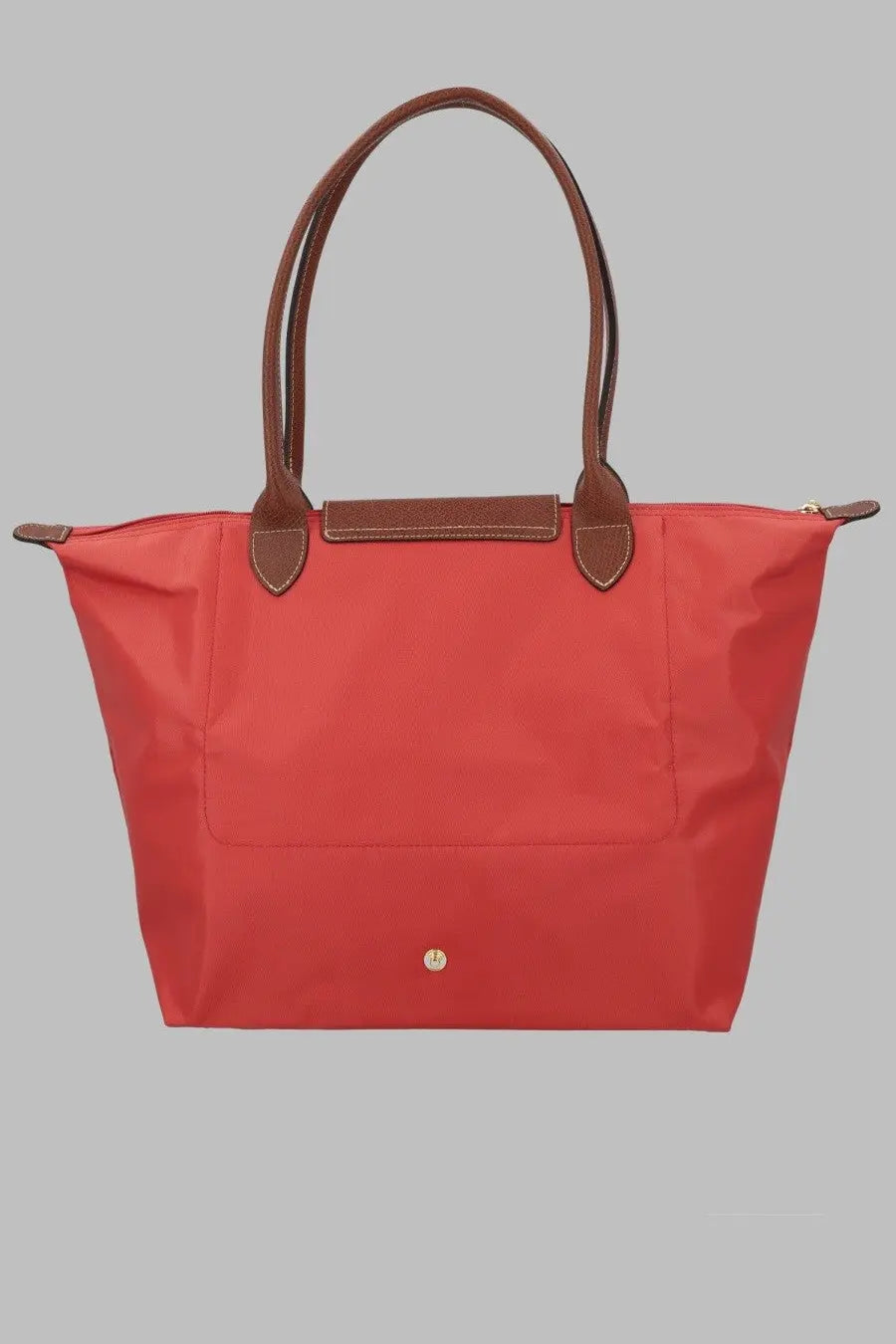 Longchamp women’s le pliage large red tote bag with brown leather handles and trim
