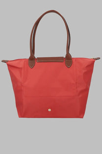 Longchamp women’s le pliage large red tote bag with brown leather handles and trim