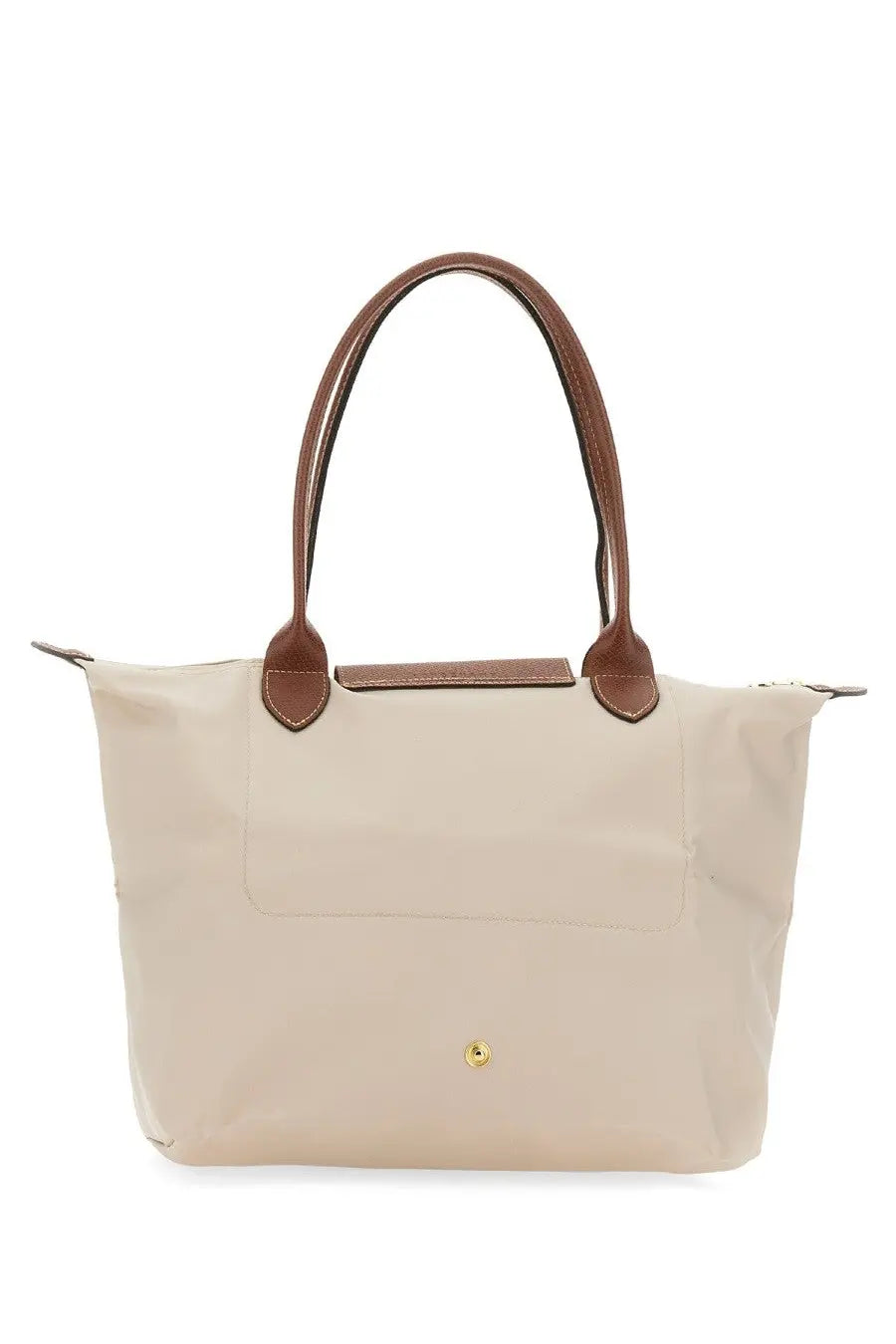 Beige longchamp women’s borsa le pliage medium tote bag with brown leather handles and trim in white background