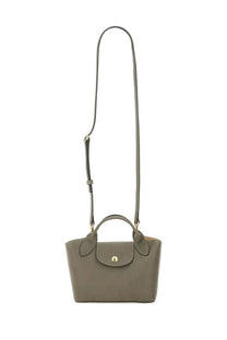 A sleek olive green longchamp le pliage handbag with textured surface and gold-tone hardware for women shopping use