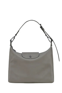 Gray Longchamp Le Pliage handbag with sleek minimalist design and signature flap closure in beige for women