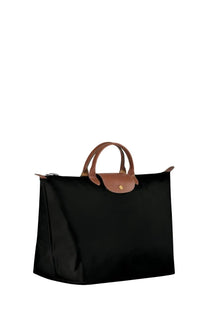 Longchamp women’s borsone da viaggio black leather tote bag with tan handles and matching flap for travel use