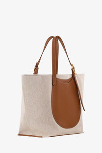 Beige longchamp women’s canvas le foulonné toile shoulder bag with brown leather handles and front pocket
