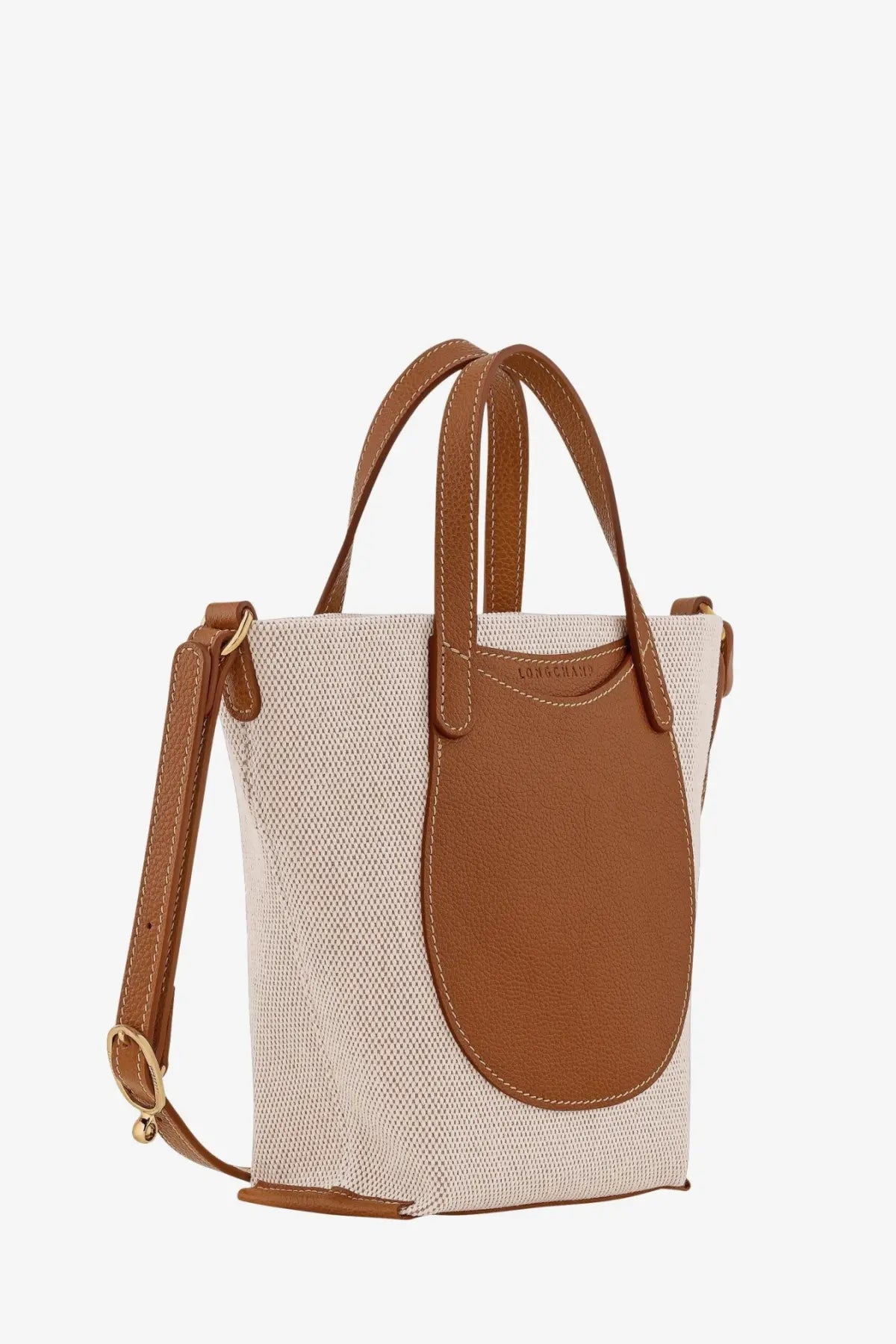 Beige longchamp women’s le foulonné canvas crossbody bag with tan leather handles and gold-tone buckle strap