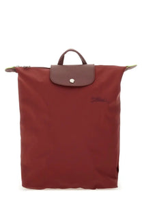 Longchamp women’s le pliage backpack in burgundy nylon with brown leather flap and silver-tone button closure
