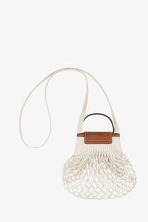 Longchamp women’s le pliage filet white cotton mesh crossbody bag with brown leather accent and black handle