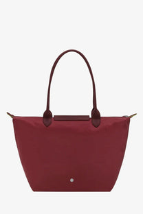 Longchamp women’s burgundy le pliage tote bag with green nylon body matching leather handles and silver-tone logo plaque