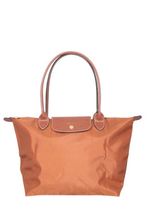 Tan longchamp le pliage medium tote bag in brown with leather handles and gold tone logo plaque