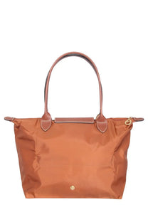 Tan longchamp le pliage medium tote bag in brown with leather handles and gold-tone hardware for everyday use