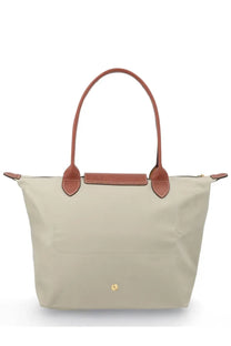 Beige Longchamp Le Pliage medium tote bag with brown leather handles and trim in gray color for women