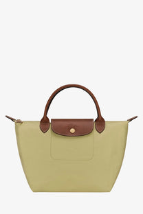 Longchamp women’s le pliage nylon handbag in sage green with brown leather handles and signature flap closure