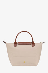 Beige Longchamp Le Pliage nylon tote bag with brown leather handles and front flap for women in white style