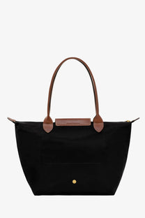 Black Longchamp le pliage original nylon tote bag with brown leather handles and gold-tone metal clasp