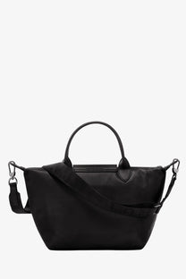 Black longchamp women’s le pliage xtra leather tote bag with durable nylon exterior and sleek minimalist design