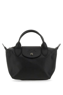 Black longchamp women’s le pliage xtra mini bag with sleek glossy nylon finish and signature top flap closure