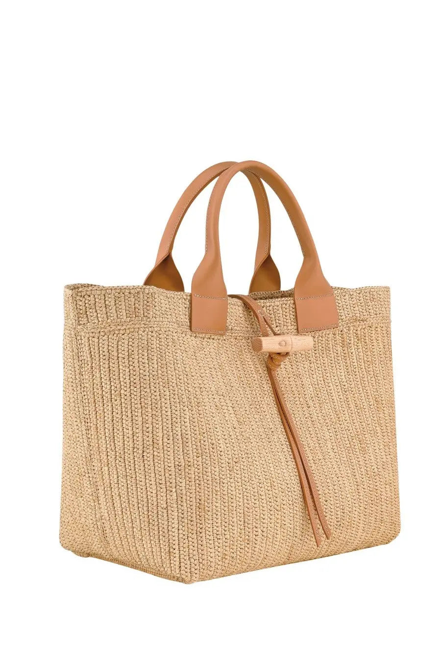 Beige woven straw longchamp women’s le roseau tote bag with tan leather handles and matching leather tie closure