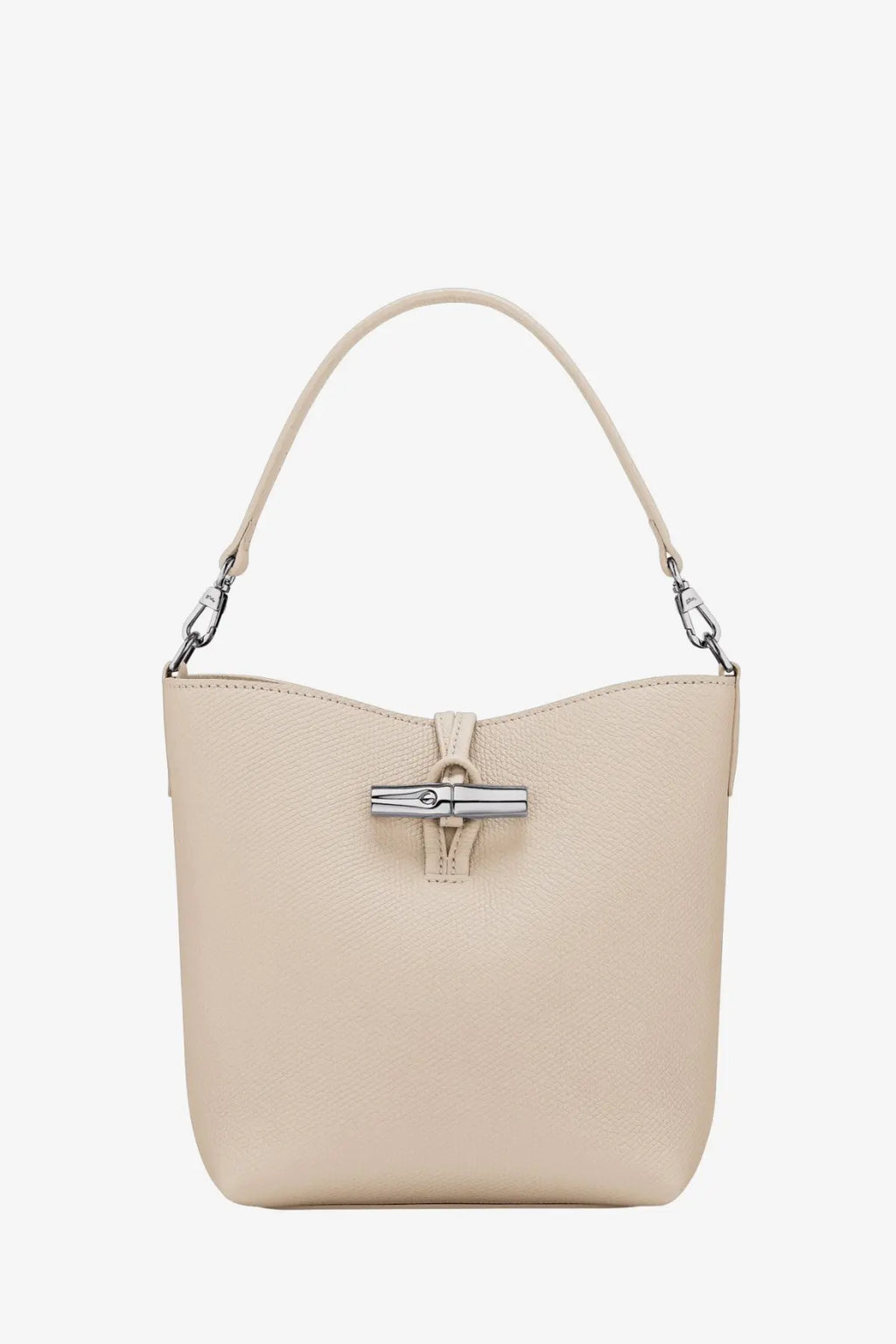 Longchamp women’s le roseau beige leather bucket bag with silver-tone clasp and matching handle in white background