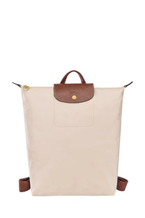 Beige longchamp women’s zaino le pliage backpack with brown leather accents and gold-tone hardware in white model