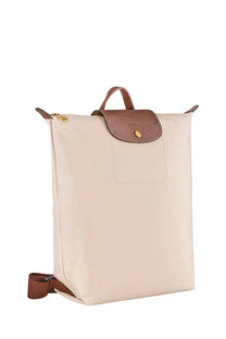 Beige Longchamp women’s zaino LE Pliage backpack with brown leather accents and gold-tone hardware
