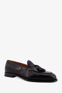 Loro Piana men’s black leather tassel loafers with polished finish and tan interior lining