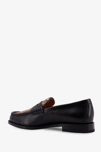 Loro Piana men’s black leather loafer with tan and brown patterned tab and serge tassel detail