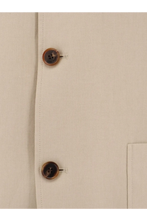 Beige linen shirt with tortoiseshell buttons paired with Loro Piana men’s spagna linen blazer orange