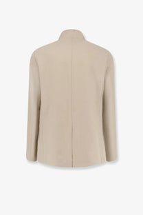 Beige Loro Piana men’s Spagna linen blazer with structured minimalist design and clean stitching in orange tone