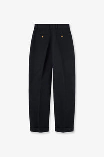 Black tailored trousers with gold toned button details on back pockets made from linen and cotton by loro piana
