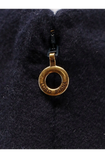 Gold-colored circular zipper pull engraved with loro piana on dark navy fabric of loro piana womens vivian cashmere skirt blue