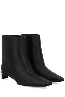 Loulou De Saison women’s black leather ankle boots with sleek minimalist design and low block heel