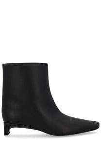 Black leather ankle boot with sleek minimalist design and low block heel from Loulou De Saison Women’s Boot Celine Lds Black
