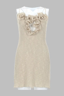 Beige textured fabric sleeveless dress adorned with ruffled rose embellishments at the neckline.