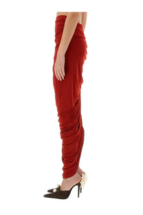 Magda Butrym women’s asymmetrical draped midi skirt in rust-red with a flowing ruched design and high waist