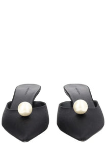 Magda Butrym women’s black satin mules featuring a prominent cream-colored pearl detail at the toe in seta con perla