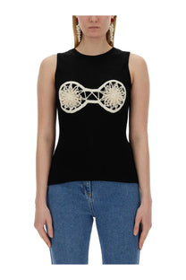 Magda Butrym women’s black sleeveless knit top with intricate cream crochet bow design across the chest