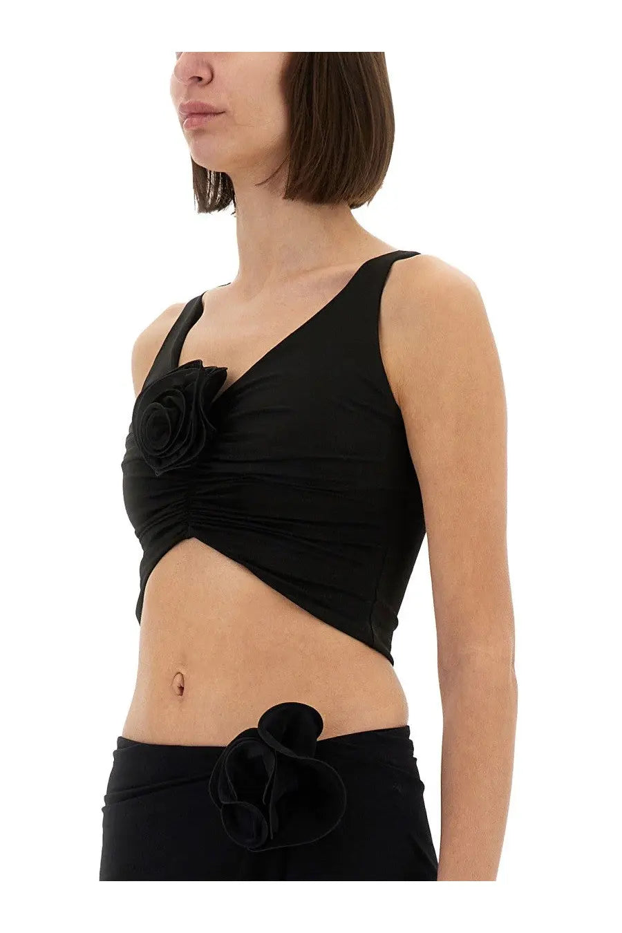 Magda Butrym women’s black ruched crop top with large fabric rose on shoulder and matching bow at waist