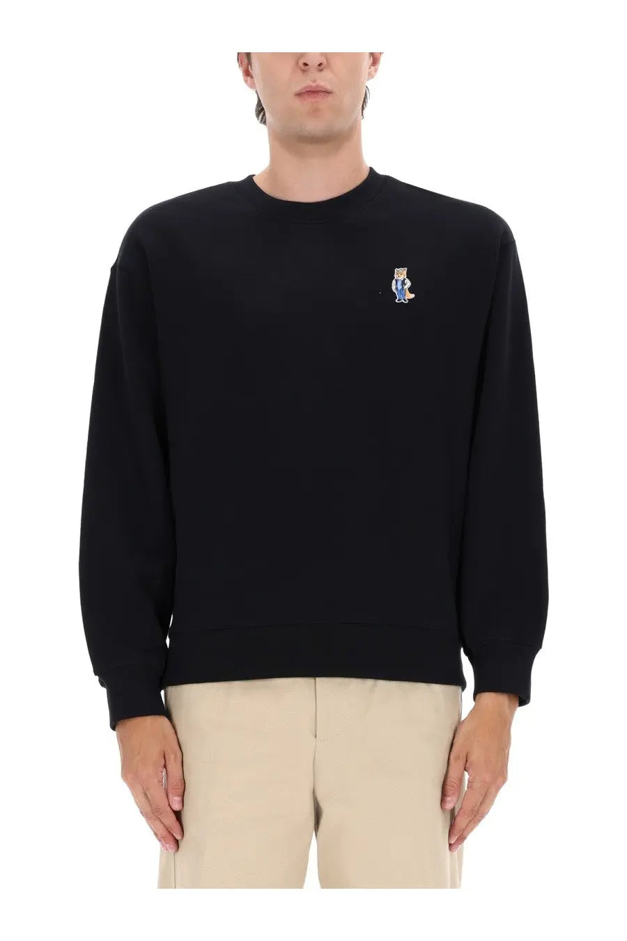 Maison Kitsuné men’s black crewneck sweatshirt with a small embroidered bear patch on the left chest