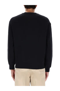Maison Kitsuné men’s long-sleeved black crewneck sweatshirt with smooth solid fabric finish for comfort wear