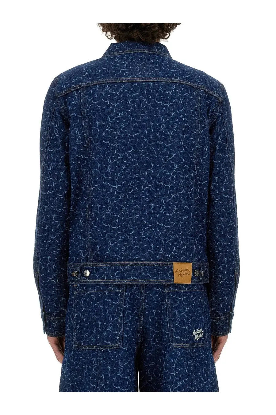 Maison Kitsuné men’s dark blue denim jacket with subtle white swirling pattern across the fabric